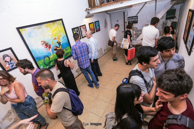 Patrons-enjoying-street-artist-Untay’s-show-at-Meshuna-Gallery-in-Florentin.-Photo-by-Neat-Eye-Images